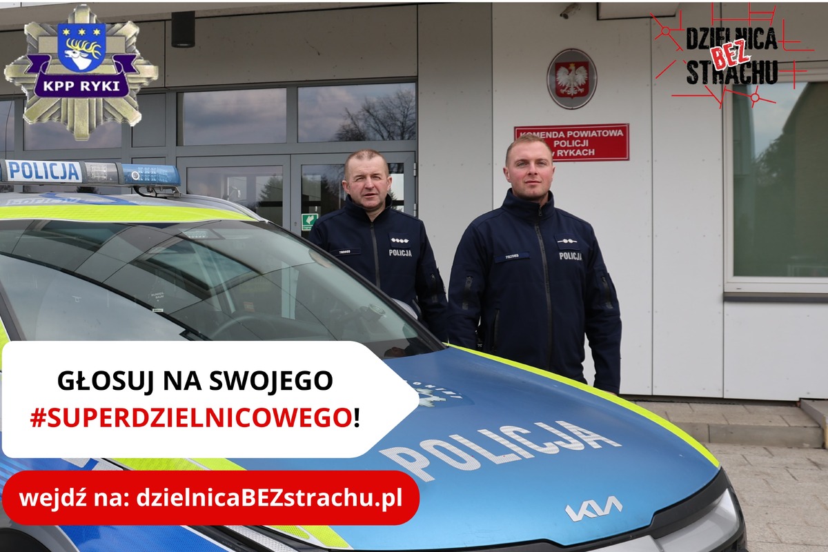 dwóch dzielnicowych stoi przy radiowozie oznakowanym w tle budynek komendy oraz napisy głosuj na swojego "superdzielnicowego wejdź na dzielnicaBezstrachu.pl