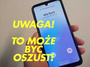 Zdjęcie telefonu trzymanego w dłoni z napisem uwaga to może być oszust