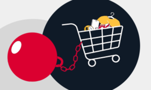 Wózek sklepowy wypełniony produktami i kulą do niego doczepioną